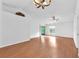 Spacious living room with wood floors, vaulted ceiling, and lots of natural light at 11816 Cedarfield Dr, Riverview, FL 33579