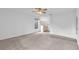 Bright main bedroom featuring carpet, ceiling fan, and an attached bathroom at 11816 Cedarfield Dr, Riverview, FL 33579