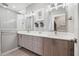 Modern bathroom with double sinks, sleek vanity, and a stylish shower with glass door at 12400 Capri N Cir, Treasure Island, FL 33706