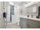 Beautiful bathroom with sleek fixtures, glass-enclosed shower, and modern vanity at 12400 Capri N Cir, Treasure Island, FL 33706