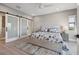 Bright bedroom with sliding door closet, ceiling fan, and blue and white bedding at 12400 Capri N Cir, Treasure Island, FL 33706