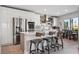 Modern kitchen with stainless steel appliances, island seating, and contemporary finishes at 12400 Capri N Cir, Treasure Island, FL 33706