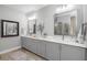 Bright bathroom with double vanity, stylish mirrors, modern fixtures, and ample counter space at 13167 Oldenburg Dr, Hudson, FL 34667