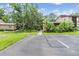 Condo complex showcases well-maintained landscaping and a neatly paved parking area at 1400 Tarpon Woods Blvd # E4, Palm Harbor, FL 34685