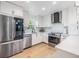 Modern kitchen showcases white cabinets, stainless steel appliances, and a bright, functional design at 1400 Tarpon Woods Blvd # E4, Palm Harbor, FL 34685