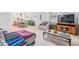 Open-concept living space with wood-look floors, seamlessly connecting the living and dining areas at 1400 Tarpon Woods Blvd # E4, Palm Harbor, FL 34685