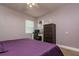 Bedroom featuring a desk area, dresser, and window with natural light, offering a functional space at 1403 W Pradera Ave, Tampa, FL 33612