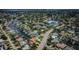 Aerial view of homes along canals featuring mature landscaping and private docks at 1427 40Th Ne Ave, St Petersburg, FL 33703