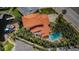 Stunning aerial view of a tile roof home with a private pool, lush landscaping, and waterfront access with a boat dock at 1427 40Th Ne Ave, St Petersburg, FL 33703