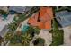 Aerial view showcases this home with a pool, paver patio, and lush landscaping offering a serene outdoor living space at 1427 40Th Ne Ave, St Petersburg, FL 33703