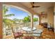 Relaxing balcony space with tropical views, ceiling fans, and comfortable seating for outdoor living at 1427 40Th Ne Ave, St Petersburg, FL 33703