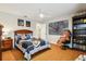 Star Wars themed bedroom with wood floors, ceiling fan, and playful decor at 1427 40Th Ne Ave, St Petersburg, FL 33703