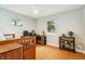 Bright bedroom featuring wood floors, dual windows, and eclectic decor at 1427 40Th Ne Ave, St Petersburg, FL 33703