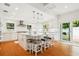 This bright and spacious kitchen boasts a large center island with seating, stainless appliances, and sleek finishes at 1427 40Th Ne Ave, St Petersburg, FL 33703