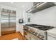 Gourmet kitchen boasts stainless steel appliances, a gas range, sleek white cabinets, and ample counter space at 1427 40Th Ne Ave, St Petersburg, FL 33703
