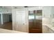 Bright kitchen featuring a stainless steel refrigerator and white cabinets at 1427 40Th Ne Ave, St Petersburg, FL 33703