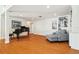 Open living area offers beautiful flooring, recessed lighting, and plenty of space for entertaining guests with an elegant piano at 1427 40Th Ne Ave, St Petersburg, FL 33703
