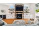 Inviting living room with a stone fireplace, built-in shelving, and modern decor at 1427 40Th Ne Ave, St Petersburg, FL 33703