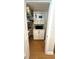 Walk-in pantry featuring built-in shelves, cabinets, and wood flooring at 1427 40Th Ne Ave, St Petersburg, FL 33703
