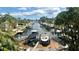 Beautiful waterfront view featuring private docks with boats on a sunny day at 1427 40Th Ne Ave, St Petersburg, FL 33703