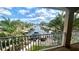 Breathtaking waterfront views of the canal from a private balcony, lush tropical landscaping at 1427 40Th Ne Ave, St Petersburg, FL 33703