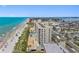 Panoramic aerial showcases beachfront condo, pool, and beautiful ocean views, with convenient beach access at 14950 Gulf Blvd # 905, Madeira Beach, FL 33708