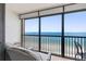 Enjoy the ocean view from the balcony with seating, perfect for relaxation and taking in the coastal scenery at 14950 Gulf Blvd # 905, Madeira Beach, FL 33708