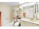 The bathroom features a tub, shower, toilet, vanity, and decor at 14950 Gulf Blvd # 905, Madeira Beach, FL 33708