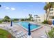 Enjoy the large community pool, with chairs and umbrellas, perfect for relaxation, by white sandy beaches at 14950 Gulf Blvd # 905, Madeira Beach, FL 33708