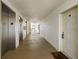Hallway view with elevator access leading to unit 905 at 14950 Gulf Blvd # 905, Madeira Beach, FL 33708