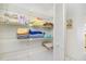 This is the condo's large linen closet with lots of shelving and supplies at 14950 Gulf Blvd # 905, Madeira Beach, FL 33708
