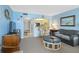 Comfortable living room featuring a breakfast bar, open to the kitchen with cozy seating and a television at 14950 Gulf Blvd # 905, Madeira Beach, FL 33708