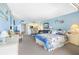 Bright living room with an open layout, light blue walls, and view to the kitchen, creating an inviting atmosphere at 14950 Gulf Blvd # 905, Madeira Beach, FL 33708