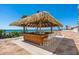 Tiki bar at the beachside pool with seating, ocean and beach views at 14950 Gulf Blvd # 905, Madeira Beach, FL 33708