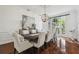 Bright dining room with views to the garden, seating for ten, and hardwood floors at 16502 Millan De Avila, Tampa, FL 33613