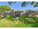 Stately brick home with manicured landscaping and a welcoming entrance at 16502 Millan De Avila, Tampa, FL 33613