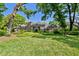 Beautiful brick home with lush landscaping and a well-maintained lawn at 16502 Millan De Avila, Tampa, FL 33613