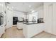 Well-equipped kitchen featuring white cabinets, tile floors, and black appliances at 16502 Millan De Avila, Tampa, FL 33613