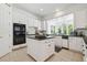 Charming kitchen with white cabinets, tile floors, and modern appliances at 16502 Millan De Avila, Tampa, FL 33613