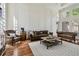 Inviting living room showcasing high ceilings, hardwood floors, and leather furnishings at 16502 Millan De Avila, Tampa, FL 33613