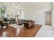Spacious living room with fireplace, hardwood floors, and stylish furnishings at 16502 Millan De Avila, Tampa, FL 33613