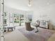 Bright home office with large windows, stylish decor, and a comfortable seating area for a productive workspace at 16502 Millan De Avila, Tampa, FL 33613