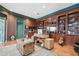 Office with built-in shelving, wood floors, and bright wall-paper at 16502 Millan De Avila, Tampa, FL 33613