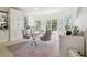 Bright office space boasts custom built-ins, a stylish desk, and plenty of natural light streaming through the windows at 16502 Millan De Avila, Tampa, FL 33613
