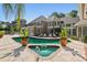 Backyard with a large pool, hot tub, and lounge chairs; perfect for outdoor relaxation at 16502 Millan De Avila, Tampa, FL 33613
