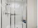 Modern bathroom with a glass enclosed shower featuring white tiles and modern fixture at 16502 Millan De Avila, Tampa, FL 33613
