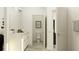 Bright bathroom with a vanity, toilet, and connecting doorway to other rooms at 16962 Warm Hand Ct, Land O Lakes, FL 34638