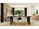 Dining area opening up to the living room, complete with a stylish table, chairs, and modern decor at 16962 Warm Hand Ct, Land O Lakes, FL 34638
