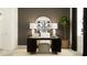 Contemporary office setup with a spacious desk, comfortable seating, elegant lamps, and a minimalist design at 16962 Warm Hand Ct, Land O Lakes, FL 34638