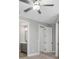 Neutral-toned bedroom featuring carpet and a ceiling fan at 17404 Nokota Ave, Hudson, FL 34667